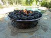 Large lava rock in 60" Barbados fire bowl