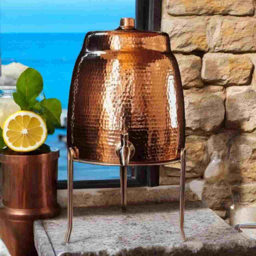 Image shows our elegant Sertodo Niagara Ayurvedic Copper Water Dispenser With Stand. It's perfect for enjoying a refreshing drink on a hot day