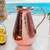 Image shows our elegant Sertodo Bisotun Ayurvedic Copper Water Pitcher adding sophistication to any kitchen or dining area. Your perfect water pitcher.