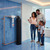 A family vieing their recently installed AquaCera Series 4  whole house water filter.