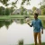Young man taking care of his suburban pond with our Aquasphere Pro