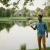 Young man taking care of his suburban pond with our Aquasphere Pro