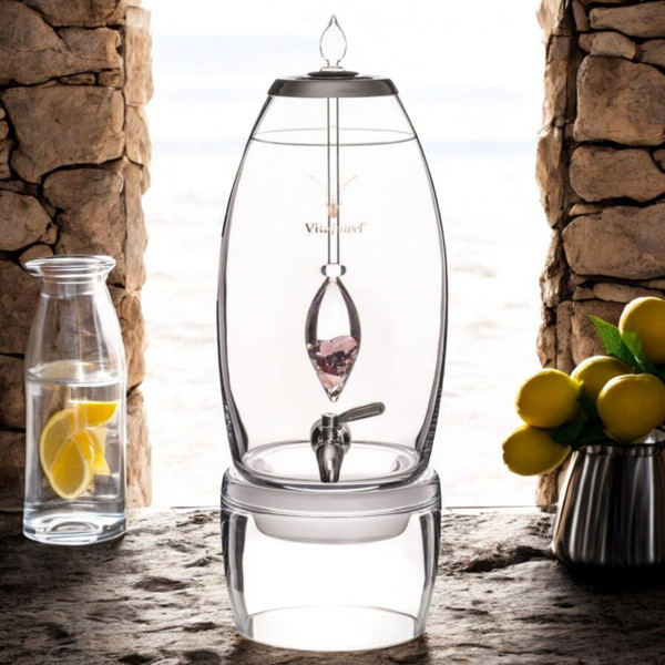 The image shows the VitaJuwel Grande LOVE Crystal Water Dispenser, infused with Rose Quartz, Garnet, and Clear Quartz, fosters harmony, compassion, and affection.