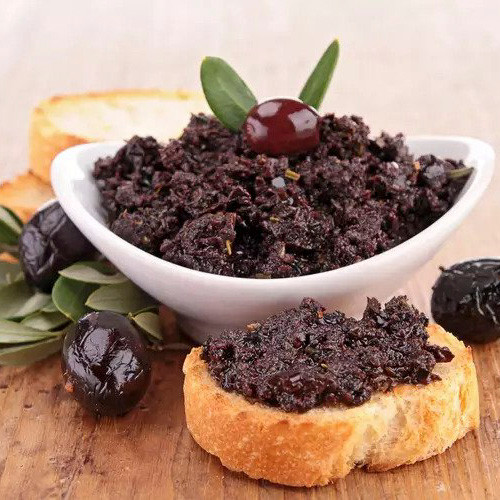Black olive paté—often called tapenade—is a rich, salty Mediterranean spread made by blending pitted black olives