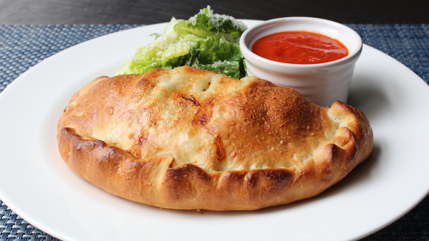 Spicy Sausage Calzone with Marinara Dipping Sauce