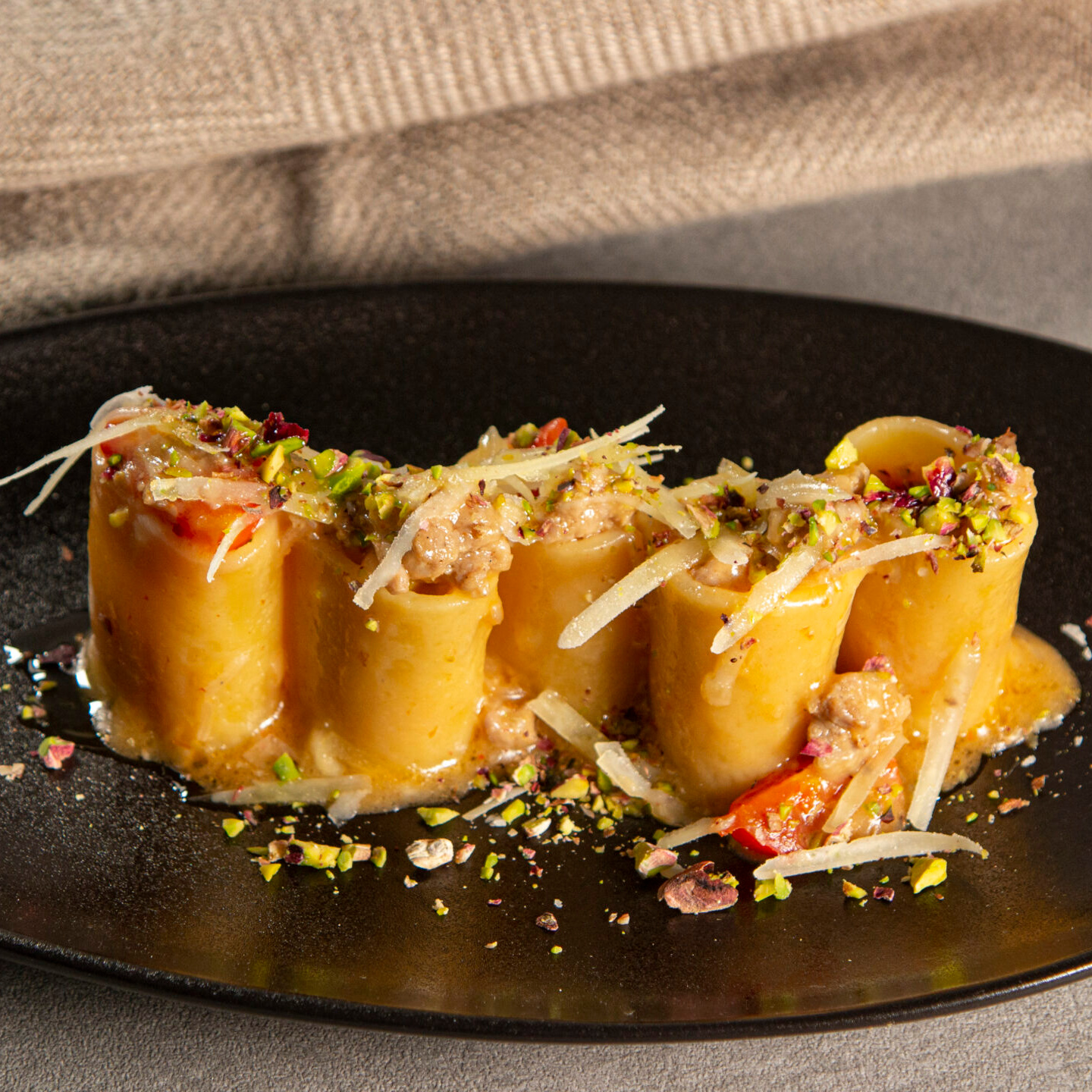 Paccheri with Sausage, Piave & Pistachio