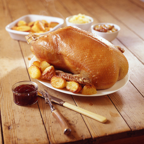 Our goose, cooked and served with potatoes and accompaniments Our goose, cooked and served with potatoes and accompaniments