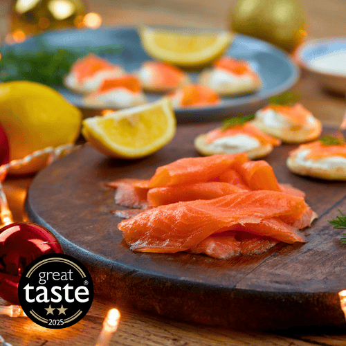 Smoked Salmon with lemon wedges on a serving board