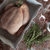 Our 100% free-range chicken uncooked in a roasting pan