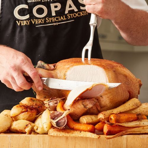 person standing with a cow