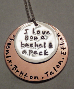"I love you a bushel and a peck" Layered Solid Sterling Silver and Copper Stamped Necklace with Kids Names ~ Mommy, Grandma, or Auntie Mixed Metal Necklace with choice of chain. It is shown with a Polished Finish on a Solid Sterling Silver Cable Chain. Choose from five custom finish options. Use the drop down menu if you would like to add Genuine Swarovski Birthstones. 
 
SIZE:
Solid Copper 1 1/4" Round 
Solid Sterling Silver 7/8" Round