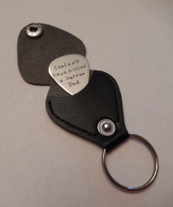 Hand Stamped Guitar Pick Keychain with Optional Black Leather Keychain Case ~ Couldn't have picked a better Dad. Shown with a Polished Finish in Solid Sterling Silver. Choice of Solid Nickel, Solid Copper, Solid Brass, Or Solid Sterling Silver. Choose from five custom finish options. Double Sided Text Optional. 
 
SIZE:
Approx. 1" x 1 1/4" Guitar Pick