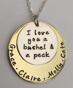 "I love you a bushel and a peck" Layered Solid Sterling Silver and Brass Hand Stamped Necklace with Kids Names ~ Mommy, Grandma, or Auntie Mixed Metal Necklace with choice of chain. It is shown with a Polished Finish on a Solid Sterling Silver Cable Chain. Choose from five custom finish options. Use the drop down menu if you would like to add Genuine Swarovski Birthstones. 
 
SIZE:
Solid Brass 1 1/4" Round 
Solid Sterling Silver 7/8" Round