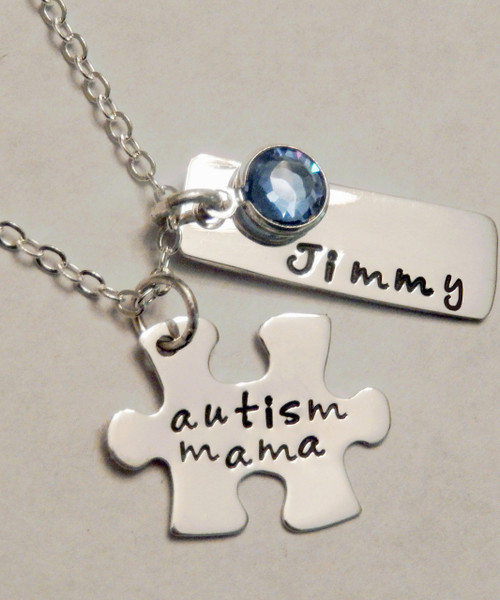 Autism Awareness Sterling Silver Jigsaw Puzzle Piece and Rectangle Name Tag Necklace with Blue Awareness Swarovski Crystal and choice of chain. It is shown with a Polished Finish on a Solid Sterling Silver Cable Chain. Choose from five custom finish options. Use the drop down menu if you would like to add Genuine Swarovski Birthstones.
 
SIZE:
Solid Sterling Silver 24 gauge Jigsaw Puzzle Piece approx. 4/5" x 1/2" 
Solid Sterling Silver 20 gauge Rectangle Name Tag approx. 1" x 1/4"
1 Blue Swarovski crystal (You may choose a different color if you wish)