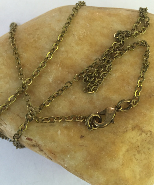 3mm Aged Brass Cable Chain with Lobster Clasp. This Solid Brass Chain has a Brass base and an Antiqued Brass Finish. Available in 16", 18", 20", 24", 28", 32", or any custom length.