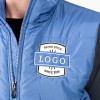 Water-resistant puffer vest with 4.4-oz. polyfill insulation and Port Pocket for decoration