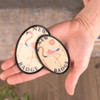 Oval patch ready for sublimation with a custom design, ideal for personalized apparel or accessories.