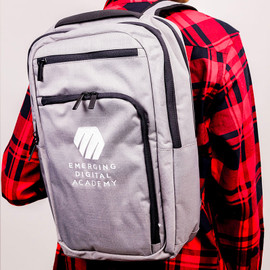 Tech backpack with custom embroidery, including adjustable sternum strap, padded air mesh back panels, and side expandable pocket.
