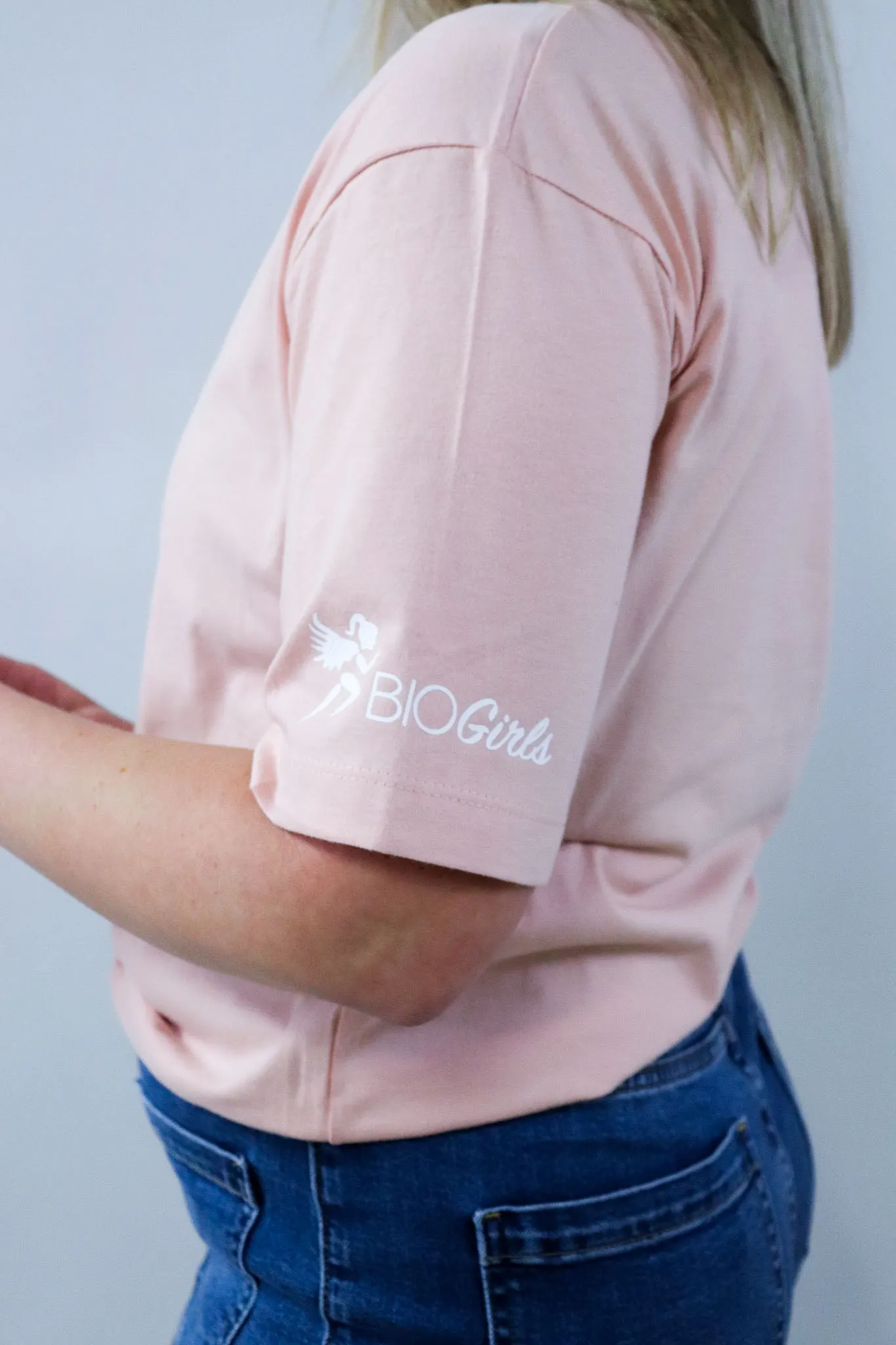 Sleeve of a BioGirls t-shirt with logo