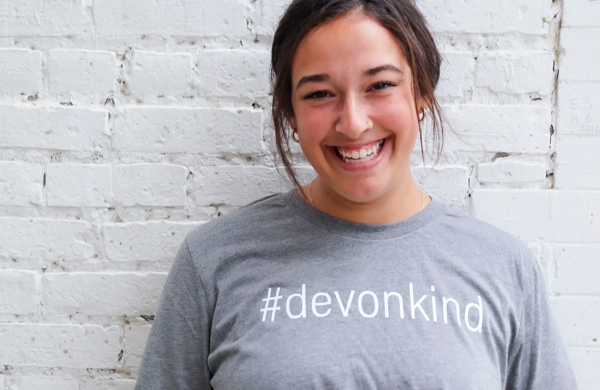 woman wearing a #devonkind t-shirt