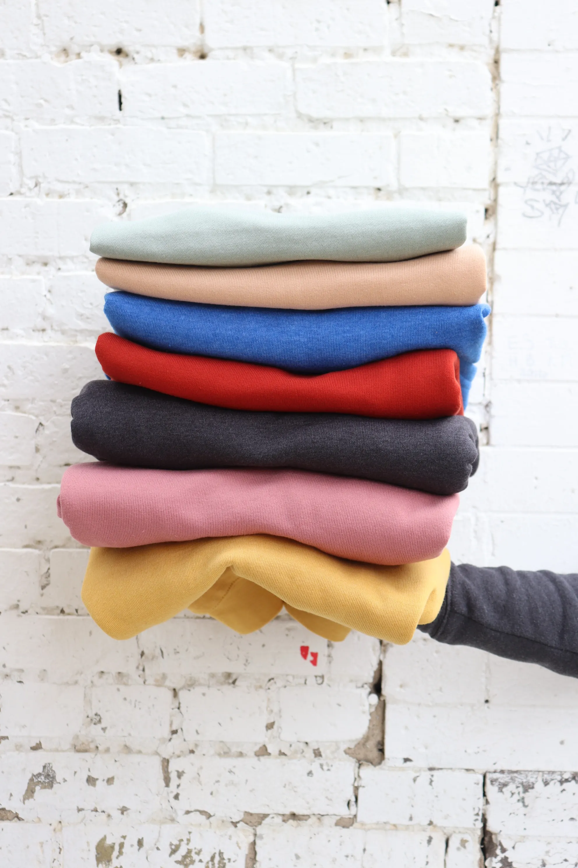 stack of colorful tshirts