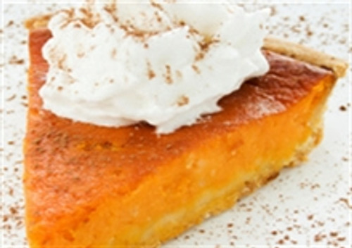 Delicious slice of pumpkin pie with whipped cream and a sprinkle of cinnamon