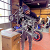 Rascal GT Mini Bike Drag Kit (RASCALGTDRAG) being held by Flacco like a baby.