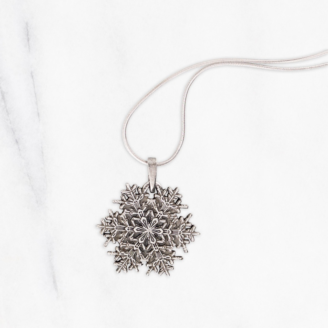 Elsa Peretti® Round pendant of snowflake obsidian and sterling silver. |  Tiffany & Co.