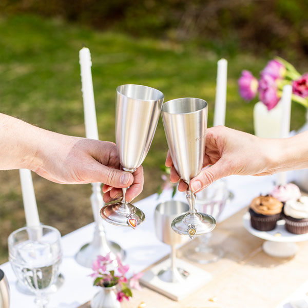 Pewter Champagne Flutes with two people doing cheers