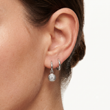 18K white gold dangling solitaire diamond bezel charm featuring an open O-ring attachment.