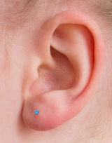 4mm Medical Grade Titanium Aqua Round CZ Ear Studs on ear