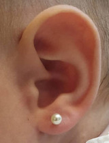Pearl Ear stud on baby's ear Pearl Ear stud on baby's ear