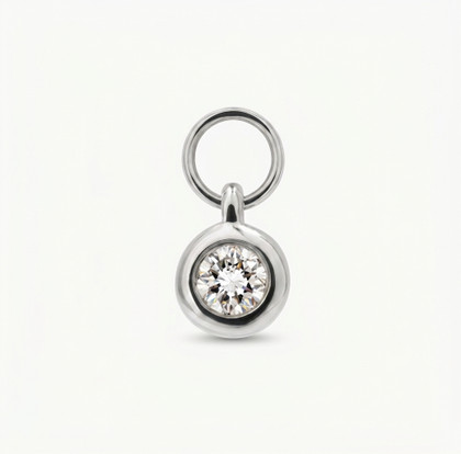 18K white gold dangling solitaire diamond bezel charm featuring an open O-ring attachment.