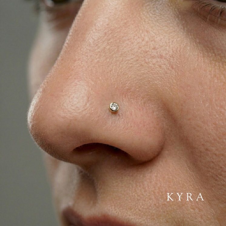 Macro photo of nose piercing, 18K Yellow Gold Bezel Set Cubic Zirconia Threaded Stud