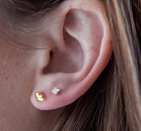 Puffed Heart in solid Yellow Gold in adult ear