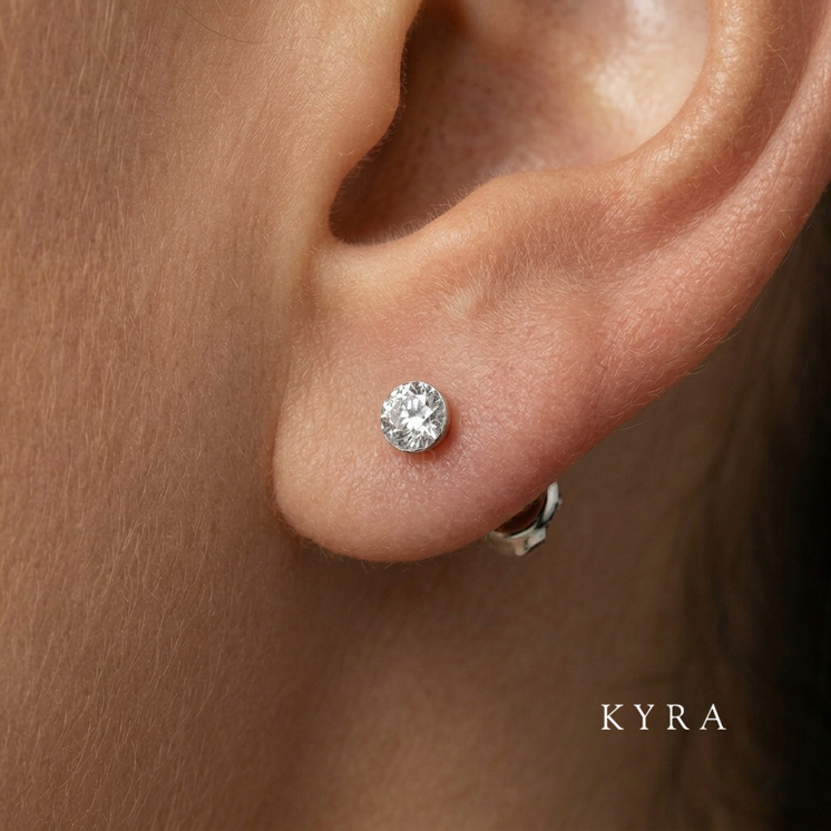 4mm Invisible Set CZ Ear Stud in Yellow Gold 14k on ear