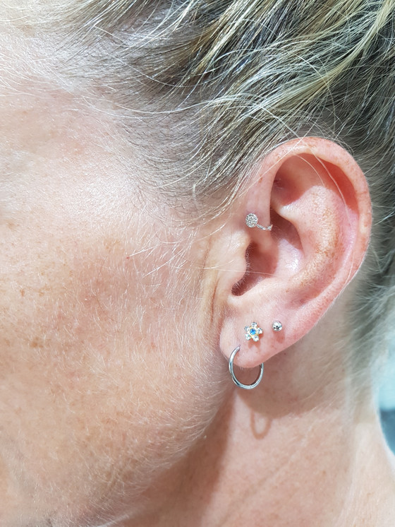 Flower Sapphire Yellow Gold Ear Stud w/ Clear CZ 14k on ear