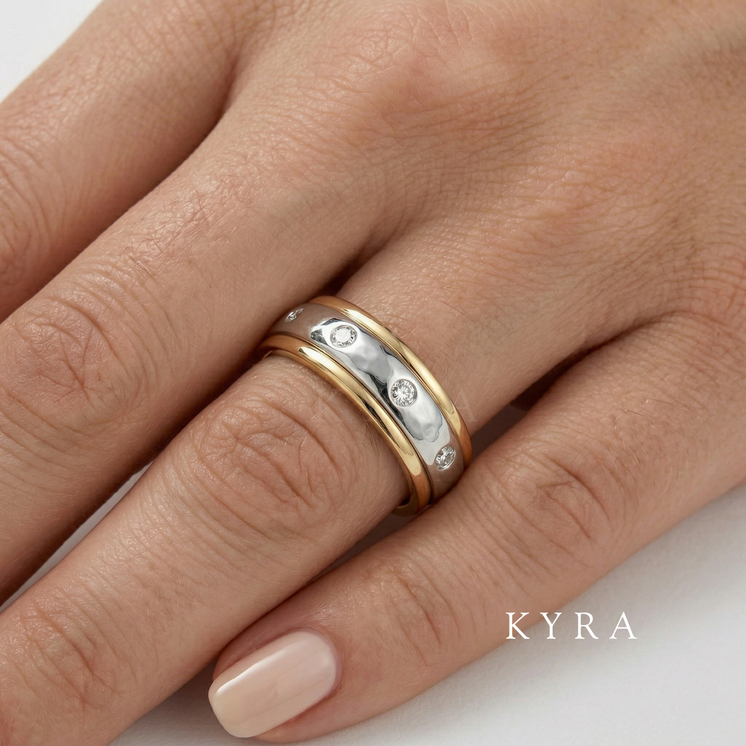 Piaget design Diamond Ring in 2 tone gold on a woman's finger