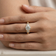 Six Prong Round Brilliant & Baguette Engagement Ring, on the hand