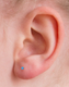 4mm Medical Grade Titanium Aqua Round CZ Ear Studs on ear