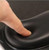 close up of full support computer arm rest padding being pressed by finger