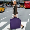 lifestyle image of carrying the garment bag