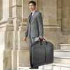 lifestyle image with man holding garment bag