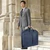 Lifestyle image with man holding garment bag
