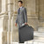 lifestyle image carrying the garment bag