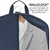 interior closeup showing garment on hanger while packing navy