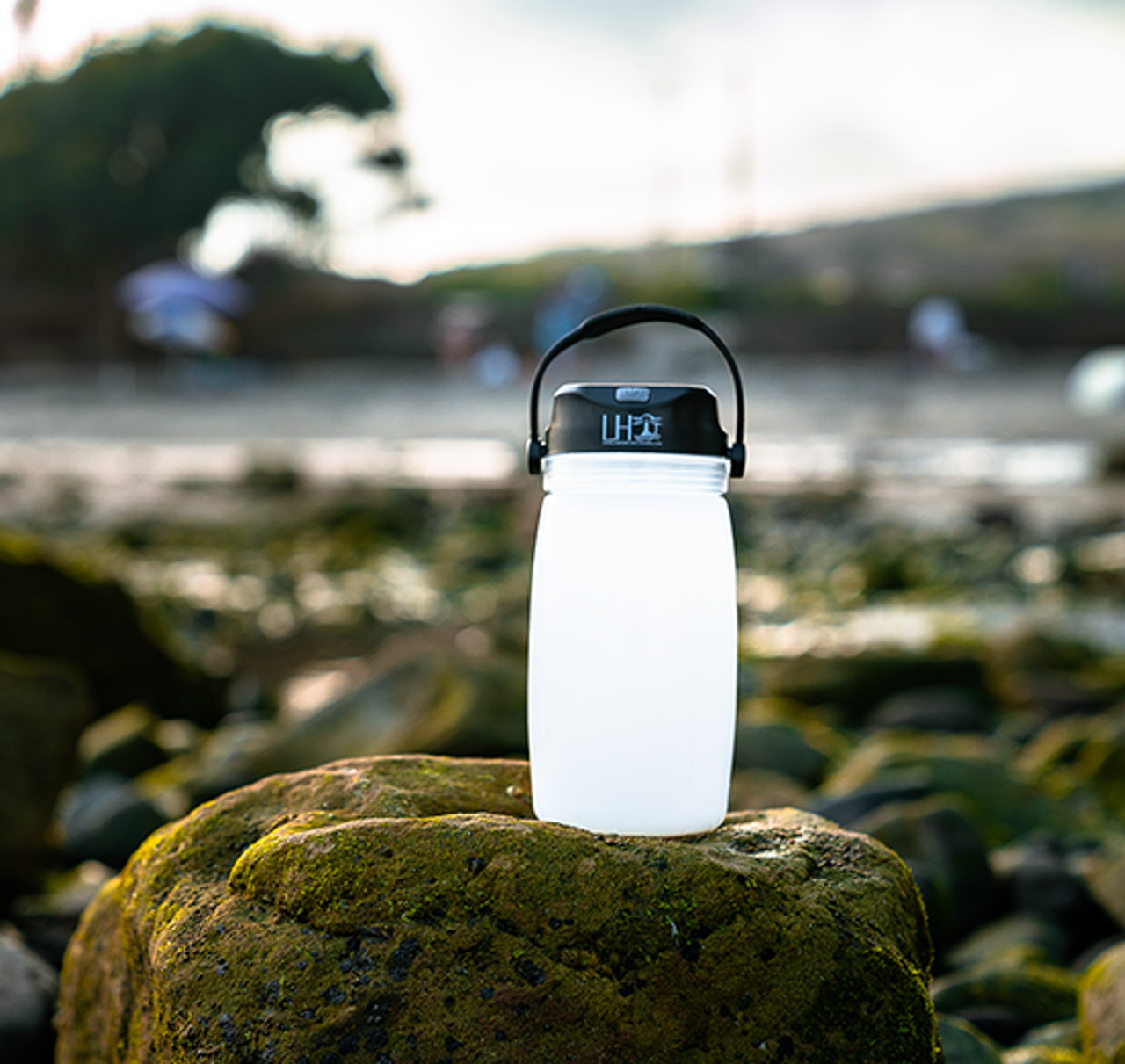 Solar camping lantern with cell charger and container