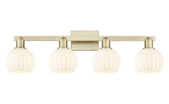 Arcadia Four Light Bath Vanity in Antique Brass (405|716-4W-AB-G1217-6WV)