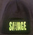 black soft material beanie cap with green savage lettering.