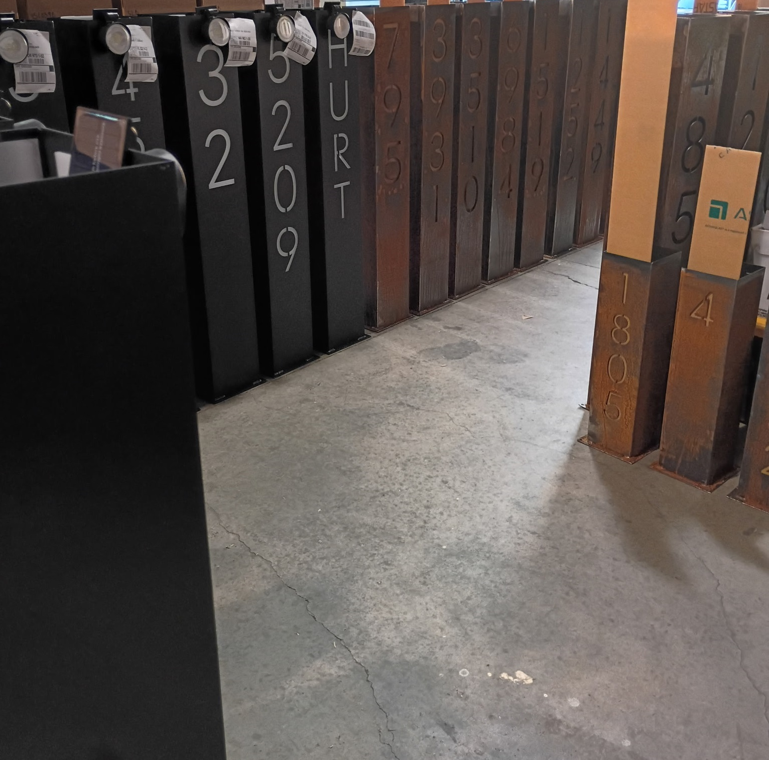 Steel address pillar installed at a finished property entrance